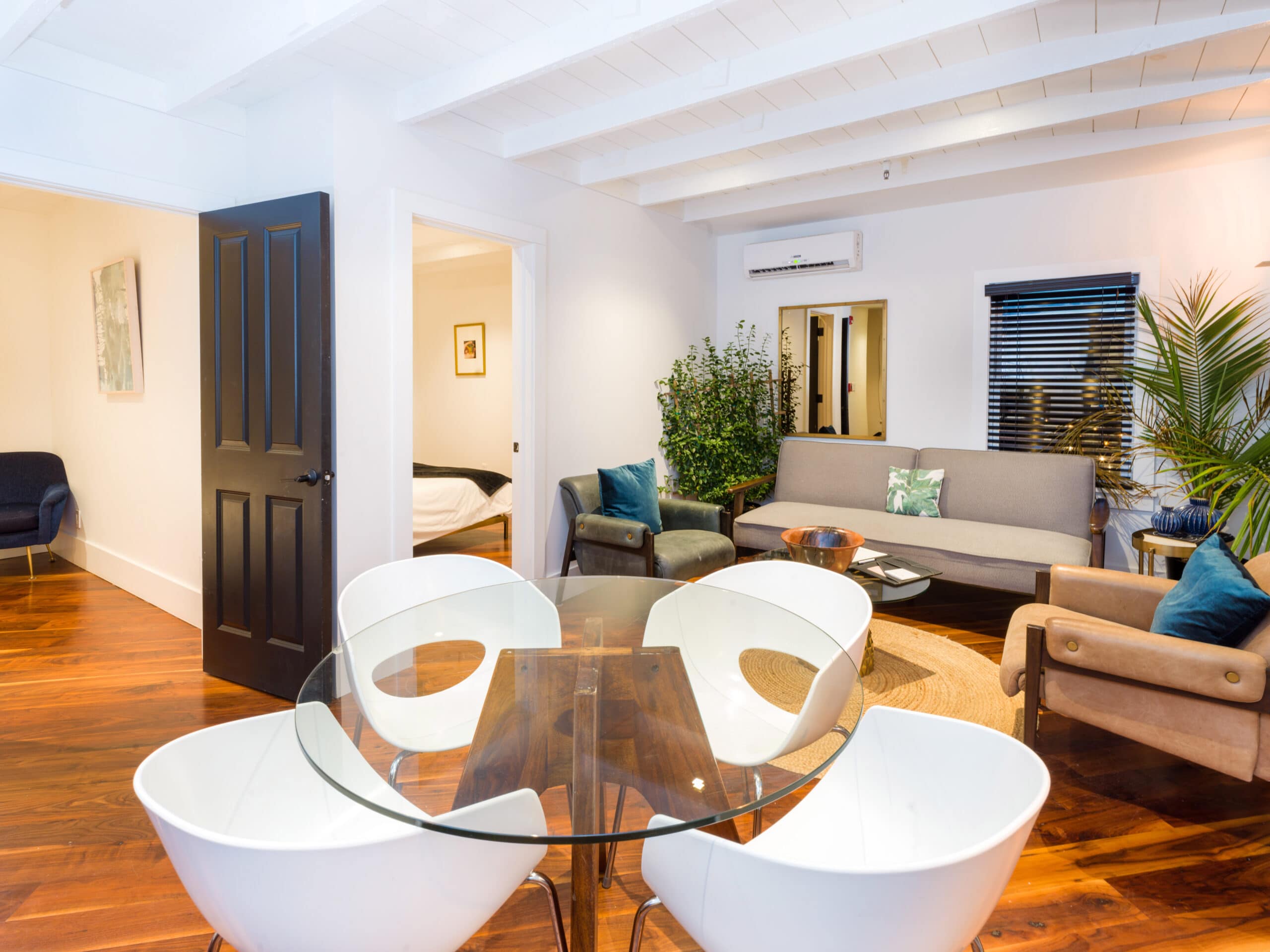 Living room with soft sofas, window, table, chairs in a hotel in Greenport
